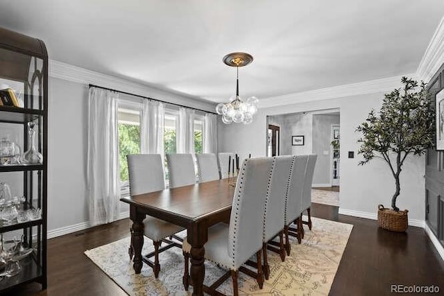 5955 Blue Sage Way, Littleton, CO 80123 - dining space with a chandelier, wood finished floors, and crown molding