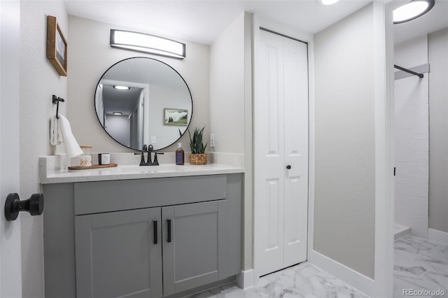 bathroom featuring tile flooring and vanity