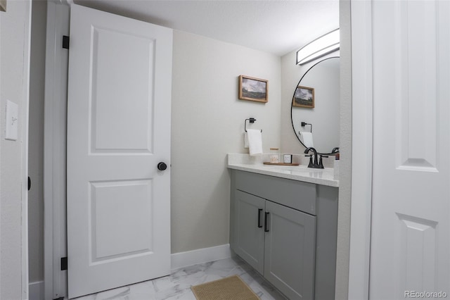 bathroom featuring tile flooring and vanity