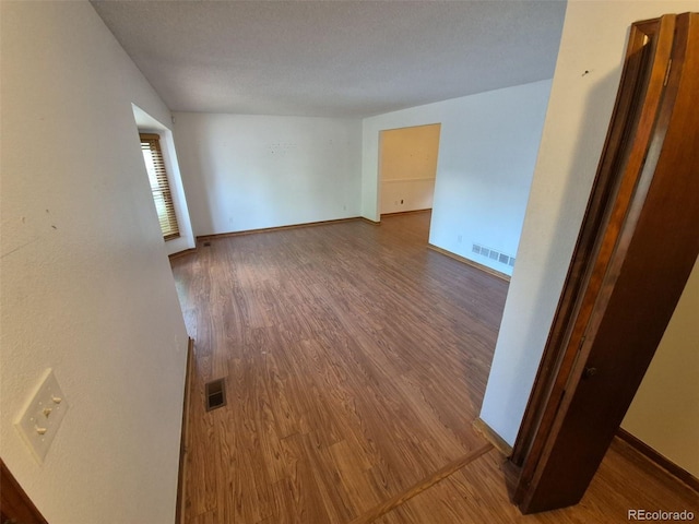3136 S Cathay Cir, Aurora, CO 80013 - spare room featuring wood finished floors and baseboards