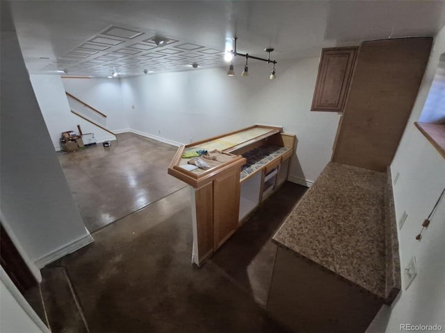 3136 S Cathay Cir, Aurora, CO 80013 - kitchen featuring finished concrete floors and baseboards