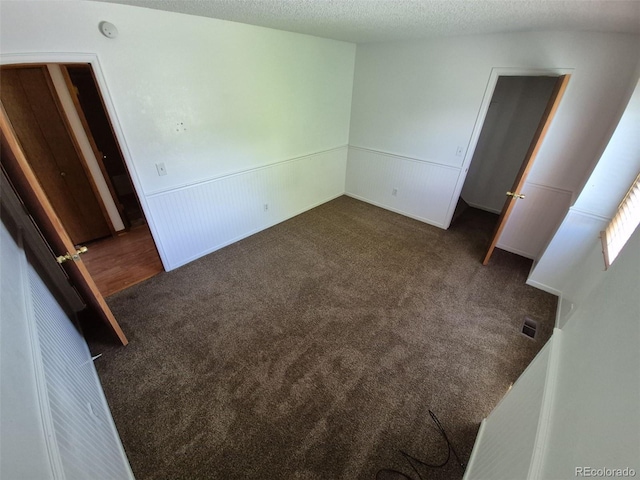 3136 S Cathay Cir, Aurora, CO 80013 - unfurnished bedroom featuring carpet floors and wainscoting