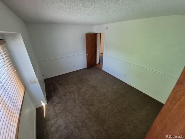 3136 S Cathay Cir, Aurora, CO 80013 - unfurnished bedroom featuring carpet floors and a textured ceiling