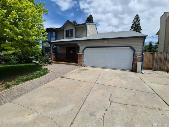 3136 S Cathay Cir, Aurora, CO 80013 - traditional-style house with brick siding, driveway, a garage, and covered porch