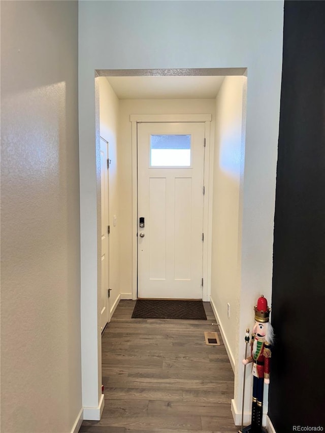 doorway featuring dark hardwood / wood-style flooring