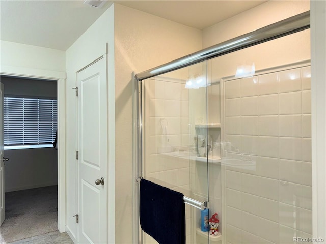 bathroom featuring an enclosed shower