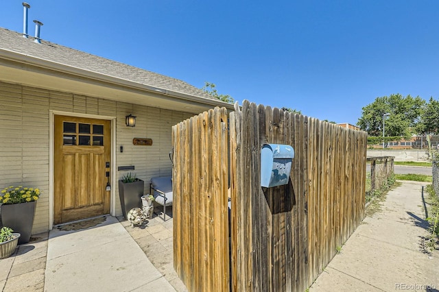 2841 N Columbine St, Denver, CO 80205 - doorway to property with a shingled roof