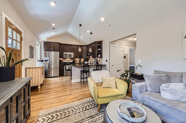 2841 N Columbine St, Denver, CO 80205 - living room with light wood-style flooring and lofted ceiling
