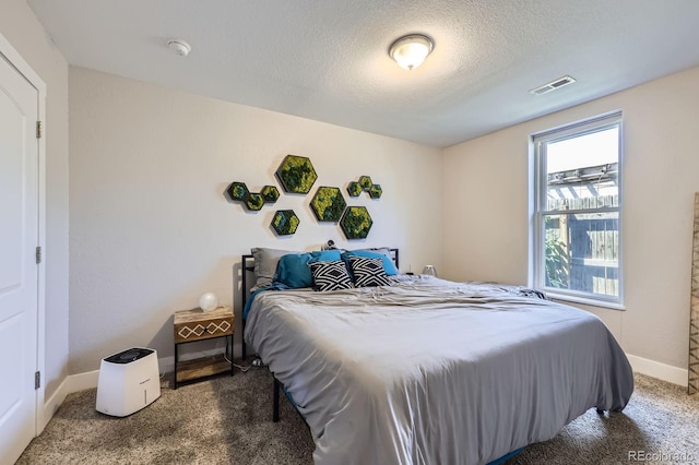 2841 N Columbine St, Denver, CO 80205 - carpeted bedroom with baseboards and a textured ceiling
