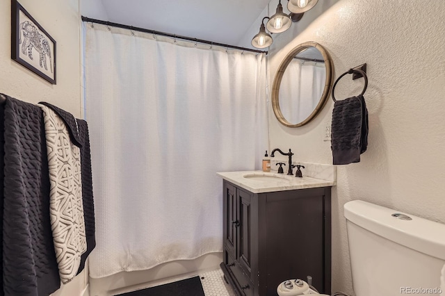 2841 N Columbine St, Denver, CO 80205 - bathroom featuring vanity, shower / bathtub combination with curtain, and a textured wall