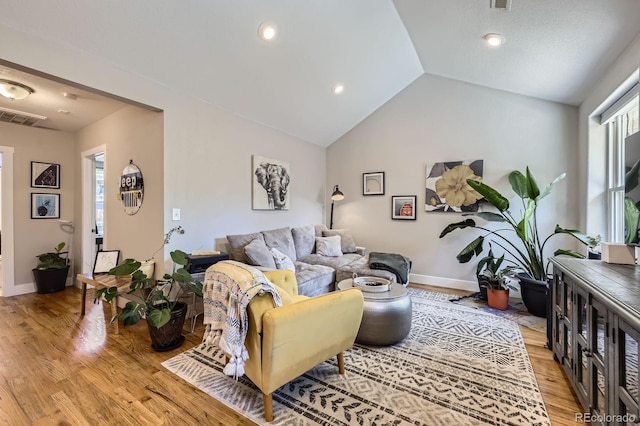 2841 N Columbine St, Denver, CO 80205 - living area featuring light wood-style floors and lofted ceiling