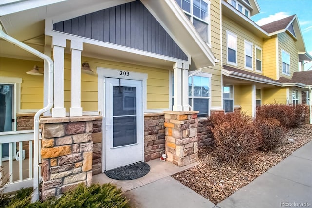 view of exterior entry with stone siding