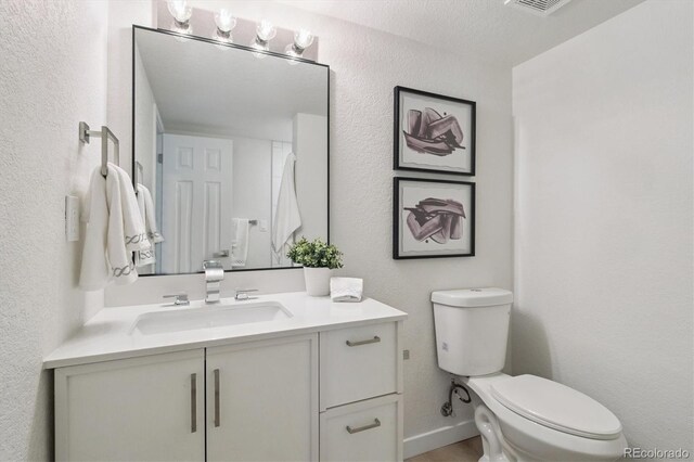 1718 S Flanders Way, Aurora, CO 80017 - bathroom featuring vanity and a textured wall