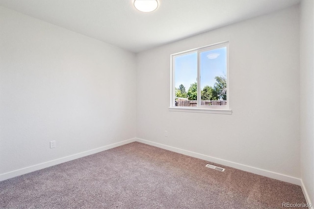 1718 S Flanders Way, Aurora, CO 80017 - spare room featuring carpet and baseboards