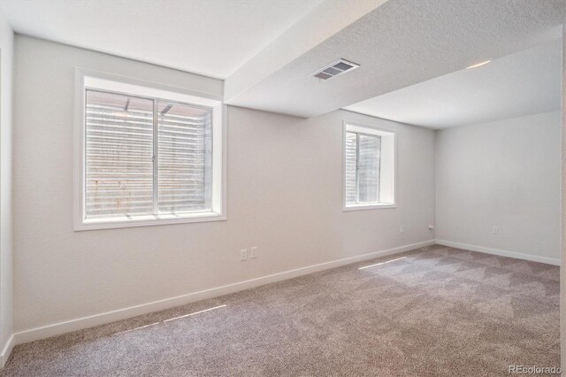 1718 S Flanders Way, Aurora, CO 80017 - spare room with light carpet and baseboards