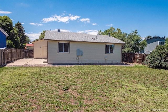 1718 S Flanders Way, Aurora, CO 80017 - rear view of property with a patio and a fenced backyard