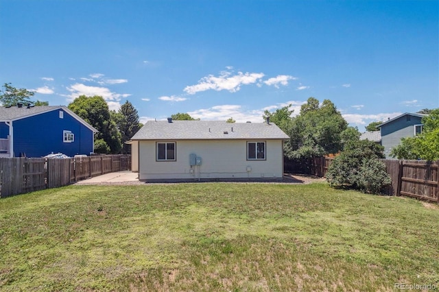 1718 S Flanders Way, Aurora, CO 80017 - rear view of house featuring a fenced backyard and a patio area