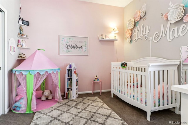 carpeted bedroom featuring a crib