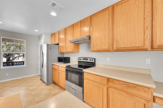 5564 Kalispell St, Denver, CO 80239 - kitchen with stainless steel appliances, under cabinet range hood, light countertops, recessed lighting, and a textured ceiling
