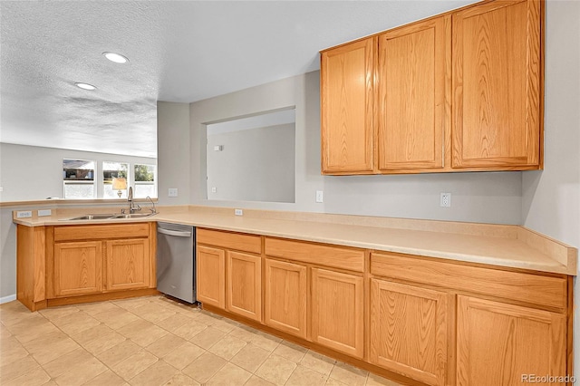 5564 Kalispell St, Denver, CO 80239 - kitchen featuring dishwasher, a textured ceiling, light countertops, recessed lighting, and a peninsula