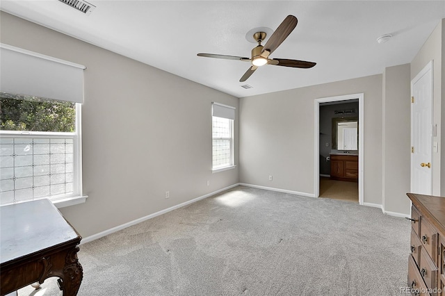 5564 Kalispell St, Denver, CO 80239 - unfurnished bedroom with light carpet, ceiling fan, and ensuite bath