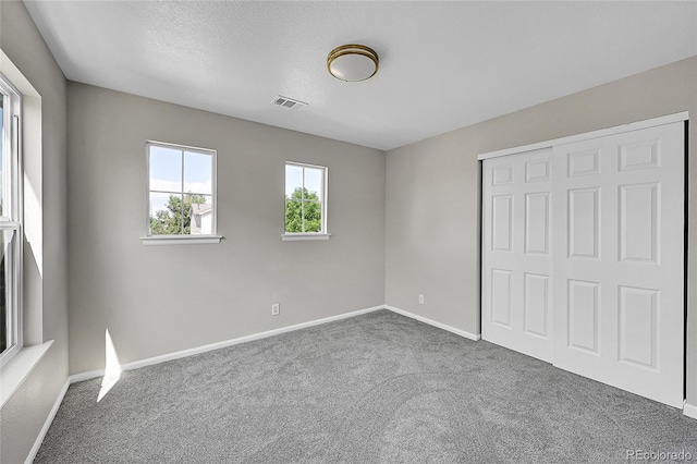 5564 Kalispell St, Denver, CO 80239 - unfurnished bedroom featuring carpet and a closet
