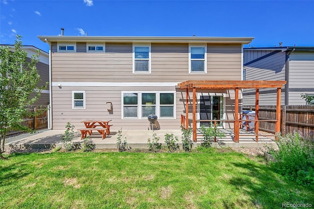 5564 Kalispell St, Denver, CO 80239 - rear view of house featuring a fenced backyard, a patio, and a pergola