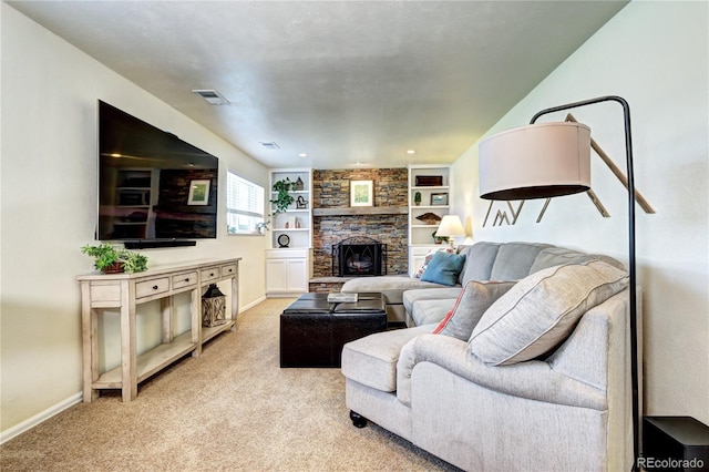 13915 W 73rd Ave, Arvada, CO 80005 - living room with a fireplace, light colored carpet, and built in shelves