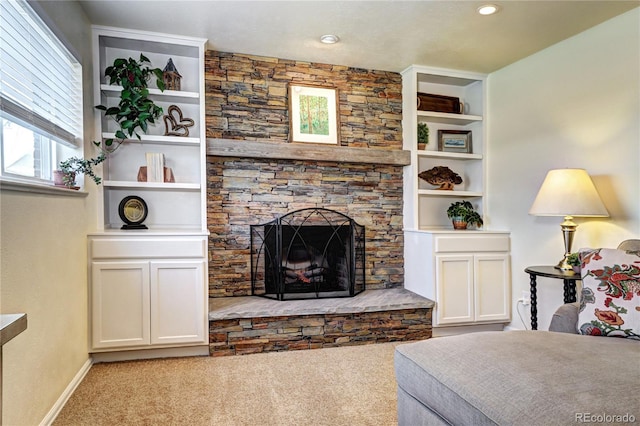 13915 W 73rd Ave, Arvada, CO 80005 - carpeted living room featuring a stone fireplace and built in shelves