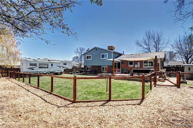 13915 W 73rd Ave, Arvada, CO 80005 - back of property with brick siding and a wooden deck