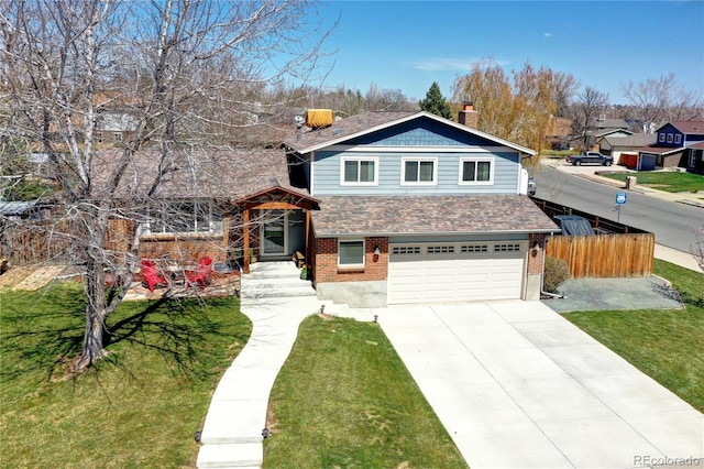 13915 W 73rd Ave, Arvada, CO 80005 - view of front of house featuring an attached garage, brick siding, driveway, and roof with shingles