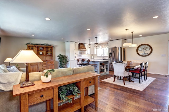 13915 W 73rd Ave, Arvada, CO 80005 - living area featuring recessed lighting and dark wood-type flooring