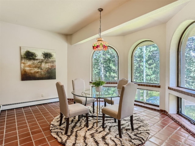 dining space featuring tile patterned flooring and a baseboard heating unit