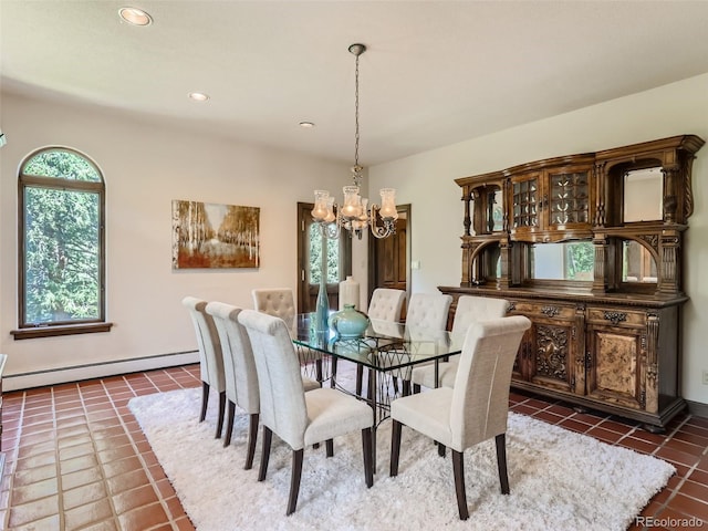 dining room with a baseboard heating unit, dark tile patterned floors, recessed lighting, and a chandelier