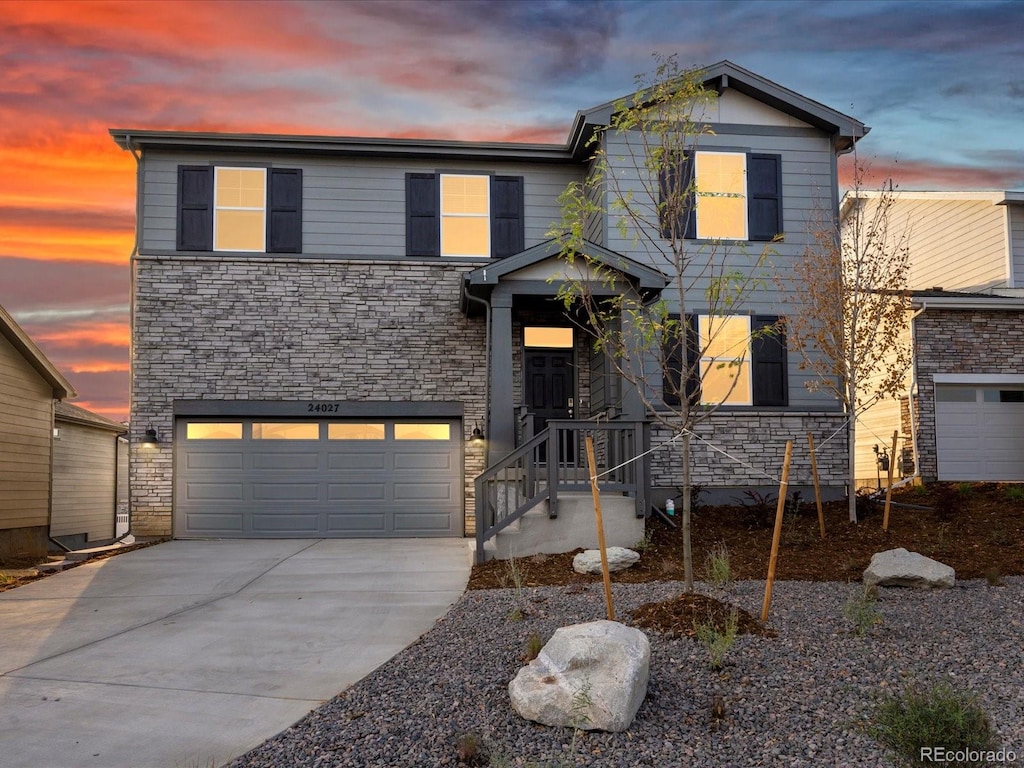 view of front of property with a garage