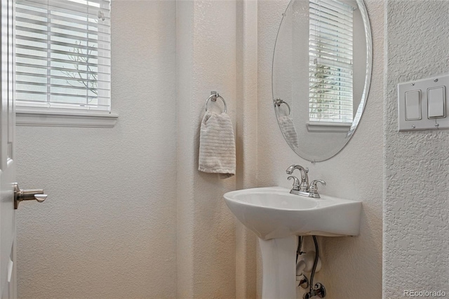 11307 Navajo Cir Unit A, Westminster, CO 80234 - bathroom featuring plenty of natural light and a textured wall