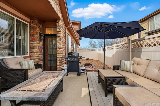 11307 Navajo Cir Unit A, Westminster, CO 80234 - fenced backyard featuring outdoor lounge area, area for grilling, and a patio area