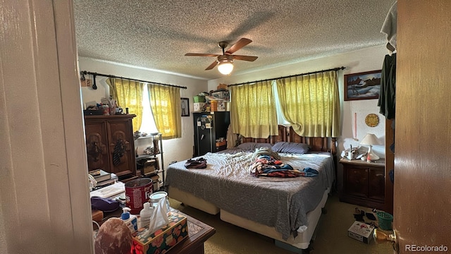 bedroom featuring a textured ceiling and ceiling fan