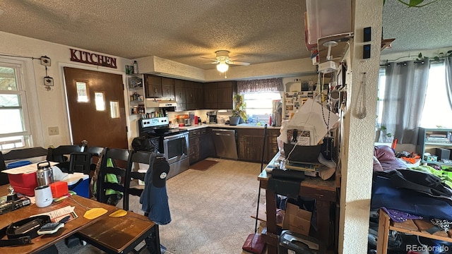 kitchen with dark brown cabinets, ceiling fan, a textured ceiling, stainless steel appliances, and light colored carpet