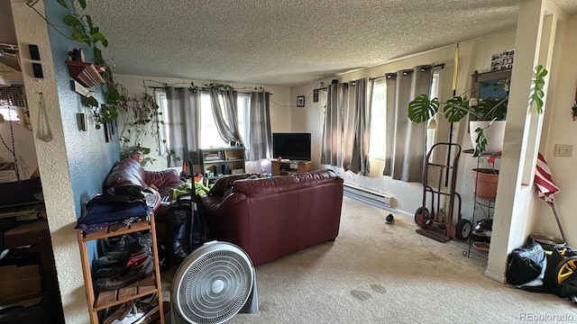 living room featuring carpet floors, a textured ceiling, and a baseboard heating unit