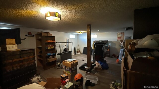 basement featuring a textured ceiling