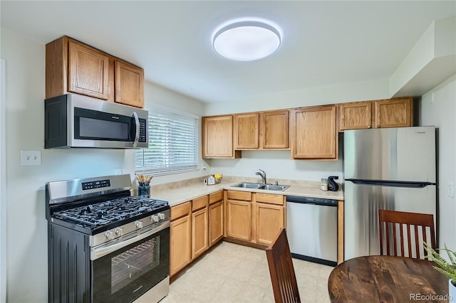 kitchen with sink and appliances with stainless steel finishes