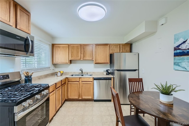 kitchen featuring appliances with stainless steel finishes and sink