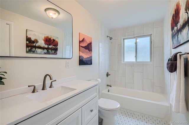 full bathroom featuring vanity, tiled shower / bath combo, and toilet