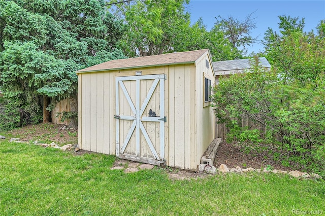 view of outdoor structure with a lawn