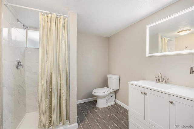 1920 Elmira St, Aurora, CO 80010 - full bath featuring vanity, a tile shower, and wood tiled floors