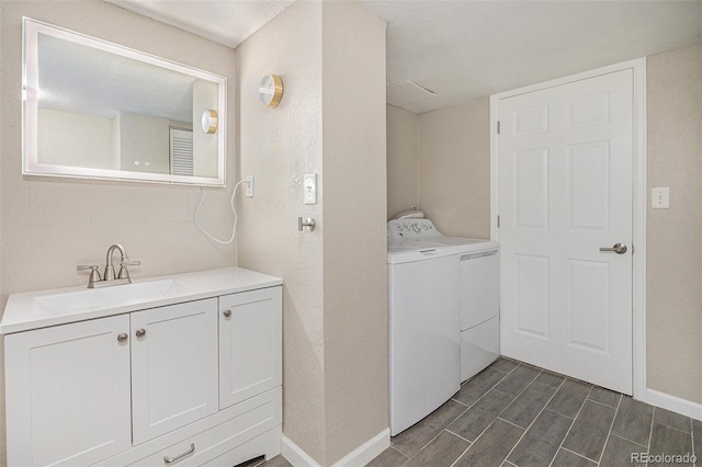 1920 Elmira St, Aurora, CO 80010 - washroom with washing machine and clothes dryer and wood finish floors