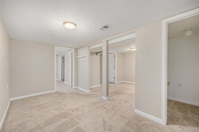 1920 Elmira St, Aurora, CO 80010 - finished below grade area featuring carpet floors and a textured ceiling