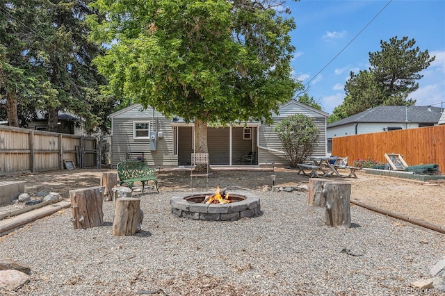 1920 Elmira St, Aurora, CO 80010 - rear view of house with an outdoor fire pit
