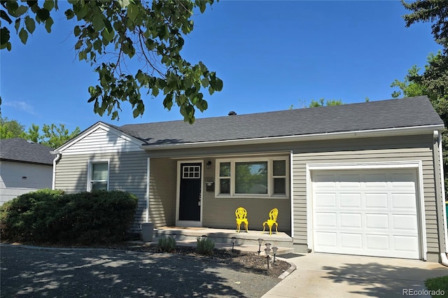1920 Elmira St, Aurora, CO 80010 - single story home featuring an attached garage, concrete driveway, and covered porch